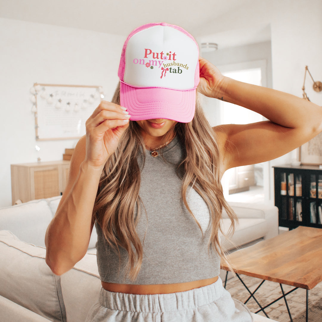 Put It On My Husbands Tab Trucker Hat